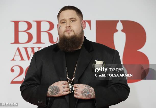 British singer-songwriter Rag'n'Bone Man poses on the red carpet on arrival for the BRIT Awards 2018 in London on February 21, 2018. / AFP PHOTO /...