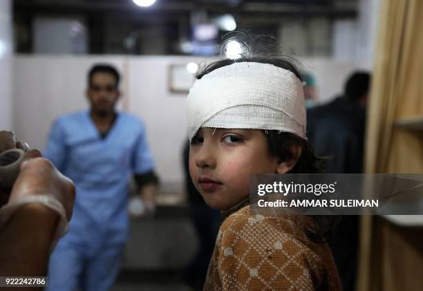 Wounded Syrian girl receives treatment at a make-shift hospital in Kafr Batna following Syrian government bombardments on the besieged Eastern Ghouta...