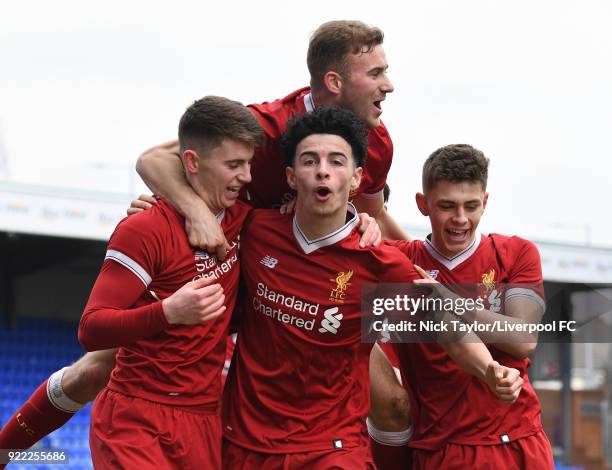 Ben Woodburn of Liverpool celebrates his goal with team mates Curtis Jones, Herbie Kane and Adam Lewis during the Liverpool v Manchester United UEFA...