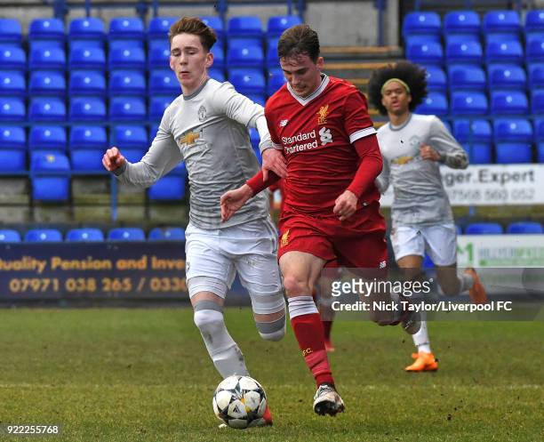 Liam Millar of Liverpool and James Garner of Manchester United in action during the Liverpool v Manchester United UEFA Youth League game at Prenton...