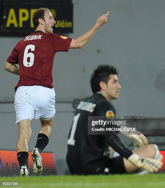 Roman Hubnik of Sparta Prague celebrates past the goalkeeper of CFR 1907 Cluj Nuno Claro after he scored during the UEFA Europa League Group K...