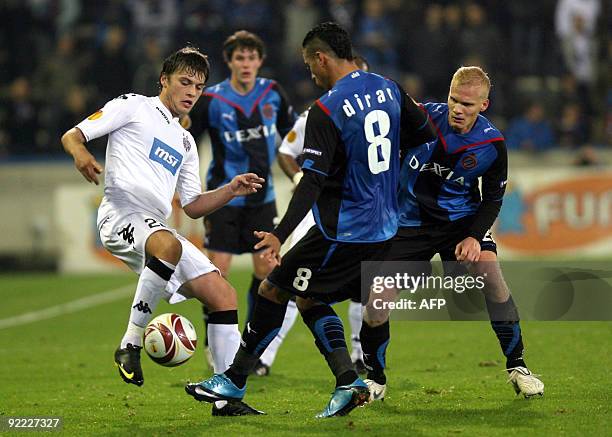 Partizan's Adem Ljajic and Club Brugge's Nabil Dirar fight for the ball during the UEFA Europa League football match between Club Brugge and Partizan...
