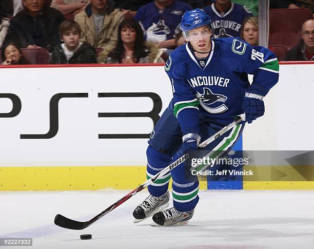 Mikael Samuelsson of the Vancouver Canucks skates up ice with the puck during their game against the Dallas Stars at General Motors Place on October...