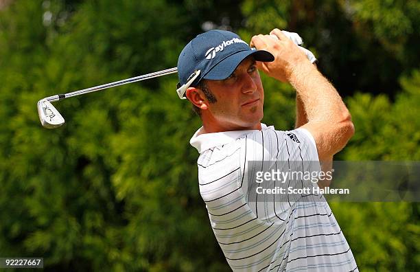 Dustin Johnson hits a shot during the first round of THE TOUR Championship presented by Coca-Cola, the final event of the PGA TOUR Playoffs for the...
