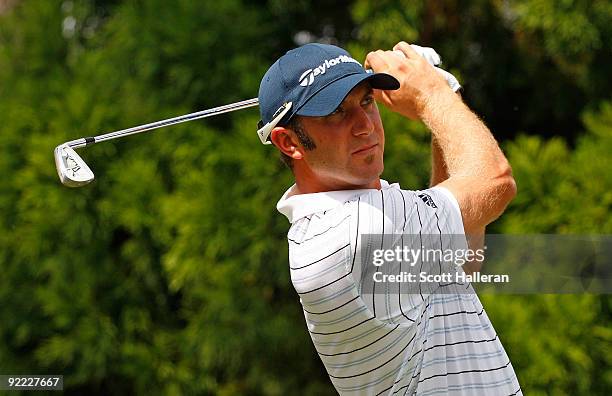 Dustin Johnson hits a shot during the first round of THE TOUR Championship presented by Coca-Cola, the final event of the PGA TOUR Playoffs for the...