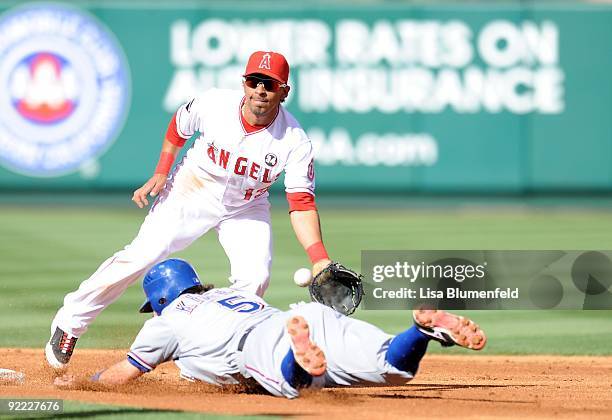 Ian Kinsler of the Texas Rangers steals second base in the second inning against Maicer Izturis of the Los Angeles Angels of Anaheim at Angel Stadium...