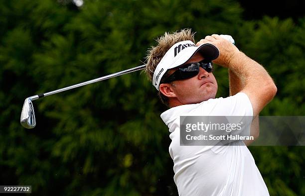 Brian Gay hits a shot during the first round of THE TOUR Championship presented by Coca-Cola, the final event of the PGA TOUR Playoffs for the FedEx...