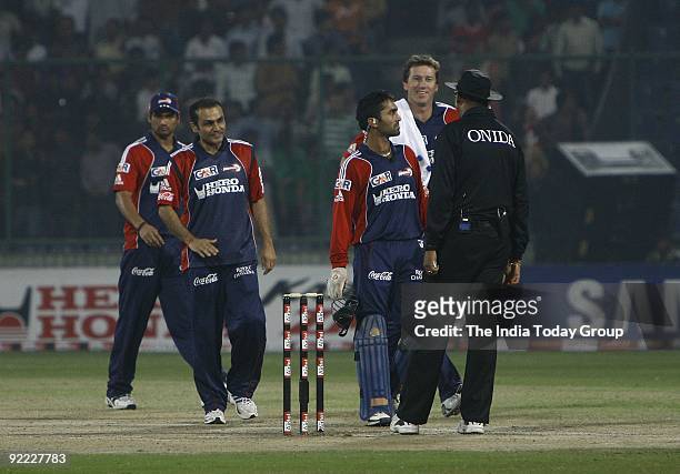 Players Glenn McGrath, Virendra Sehwag, Pradeep Sangwan and Dinesh Kartik of Team Delhi Daredevils during Champions League Twenty20 Super Eight match...