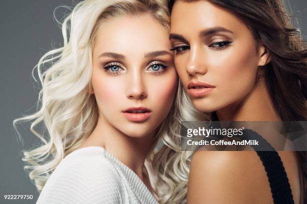 photo of two beautiful girls - girl hair stock pictures, royalty-free photos & images