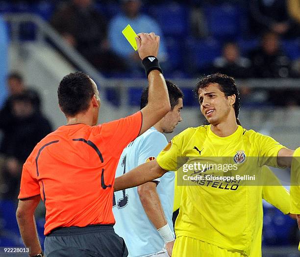 Refree Ivan Bebeke shows a yellow card to Nilmar of Vllarreal CF during the UEFA Europa League group G match between SS Lazio and Villareal CF at...