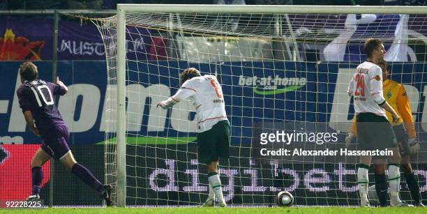 Schumacher of Vienna scores his team's second goal while Clemens Fritz of Bremen reacts during the UEFA Europa League Group L match between Austria...