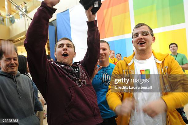 Chandler Faas of Chandler, Arizona, Tyler Rockwood of Phoenix and Dylan Makemson of Chandler, Arizona start the wave while waiting for the opening of...