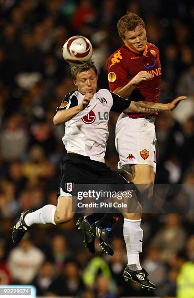 Bjorn Helge Riise of Fulham battles for the ball with his brother John Arne Riise of AS Roma during the Group E Europa League match between Fulham...