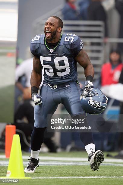 Aaron Curry of the Seattle Seahawks celebrates as he enters the field before the game against the Arizona Cardinals on October 18, 2009 at Qwest...
