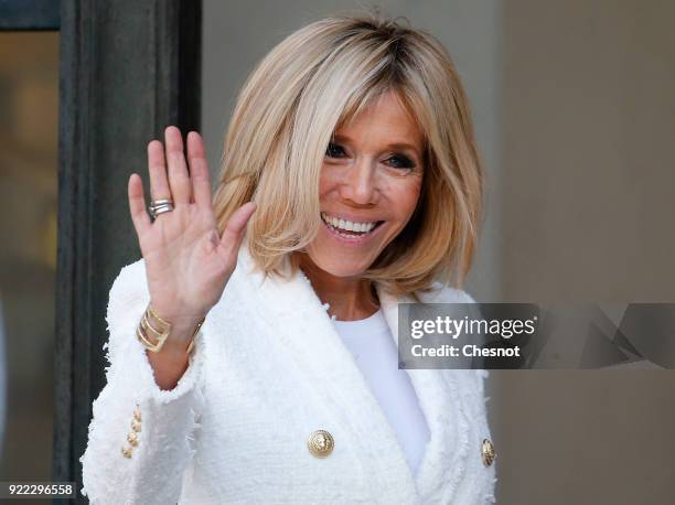 French President's wife Brigitte Macron waves as she accompanies Liberia President's wife Clar Weah after their lunch with French President Emmanuel...