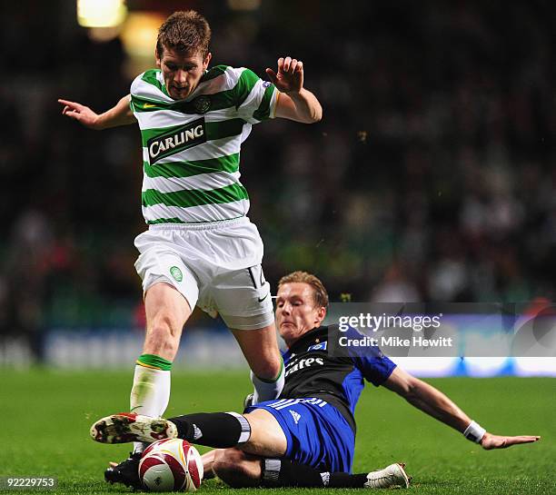 Mark Wilson of Celtic is tackled by Marcell Jansen of Hamburger SV during the UEFA Europa League Group C match between Celtic and Hamburger SV at...