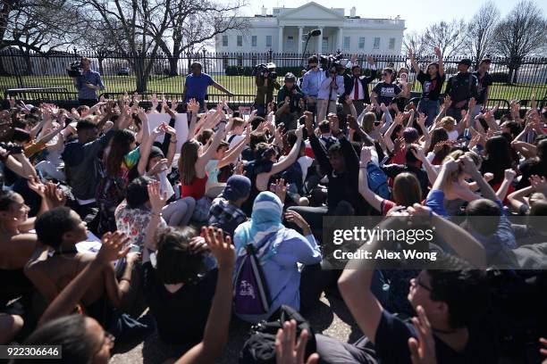 Students hold up their hands as they participate in a protest against gun violence February 21, 2018 outside the White House in Washington, DC....
