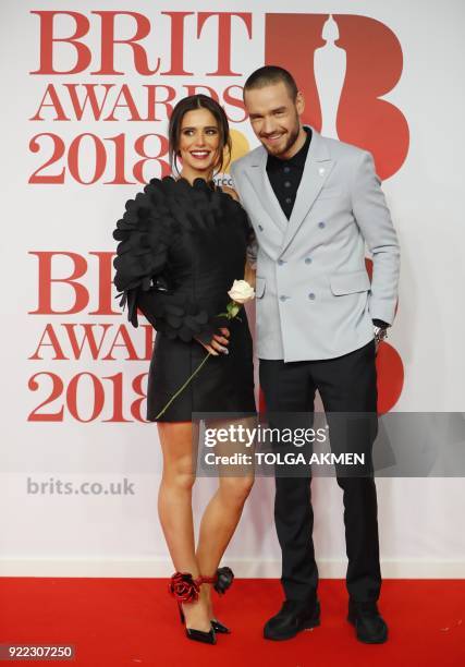 British singer-songwriter Liam Payne and partner Cheryl pose on the red carpet on arrival for the BRIT Awards 2018 in London on February 21, 2018. /...