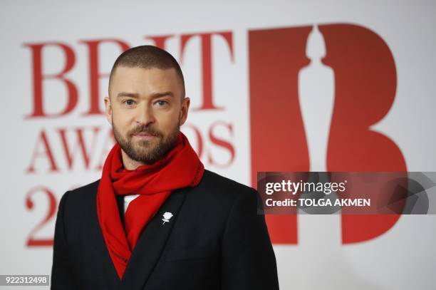 Singer-songwriter Justin Timberlake poses on the red carpet on arrival for the BRIT Awards 2018 in London on February 21, 2018. / AFP PHOTO / Tolga...