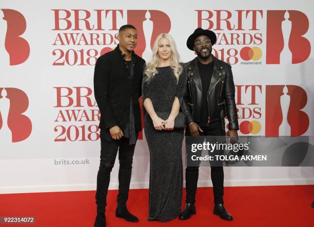 Kiss FM breakfast presenters Rickie Haywood Williams, Charlie Hedges and Melvin O'Doom pose on the red carpet on arrival for the BRIT Awards 2018 in...