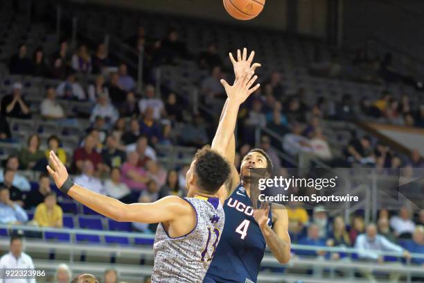 Connecticut Huskies guard Jalen Adams throws a shot over East Carolina Pirates forward Justin Whatley during a game between the ECU Pirates and the...