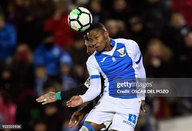 Leganes's Guadaleupean forward Claudio Beauvue heads the ball during the Spanish league football match Club Deportivo Leganes SAD against Real Madrid...