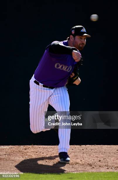Colorado Rockies relief pitcher Adam Ottavino delivers a pitch during workouts on February 21, 2018 at Salt River Fields at Talking Stick in...
