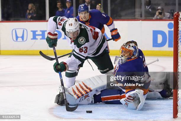 Tyler Ennis of the Minnesota Wild takes a shot against Jaroslav Halak of the New York Islanders in the first period during their game at Barclays...