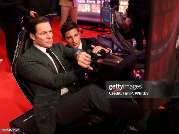 Paul Sculfor and Mitch Evans compete on the Formula E Simulators at the BRITS official aftershow party, in partnership with Tempus Magazine, at the...