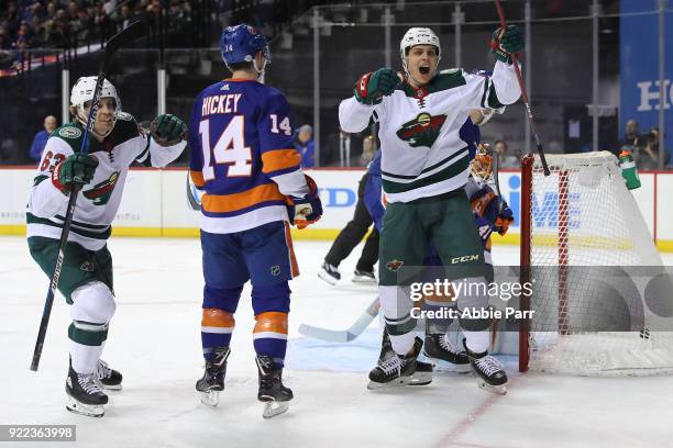 Joel Eriksson Ek of the Minnesota Wild celebrates with teammate Tyler Ennis after scoring a goal in the first peroid against the New York Islanders...