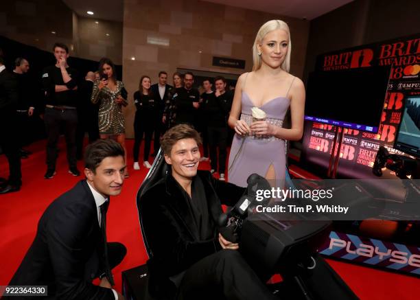 Mitch Evans, Oliver Cheshire and Pixie Lott compete on the Formula E Simulators at the BRITS official aftershow party, in partnership with Tempus...