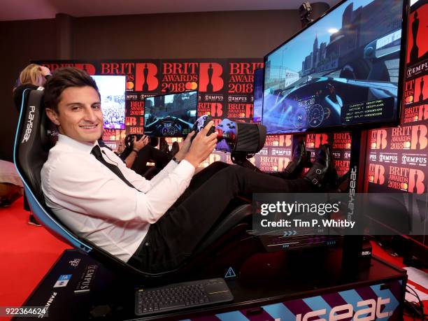 Mitch Evans competes on the Formula E Simulators at the BRITS official aftershow party, in partnership with Tempus Magazine, at the Intercontinental...