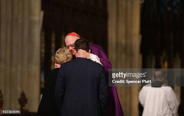 Cardinal Timothy Dolan hugs members of the Byrne family as at St. Patrick's Cathedral as a memorial Mass is held for NYPD Officer Edward Byrne almost...