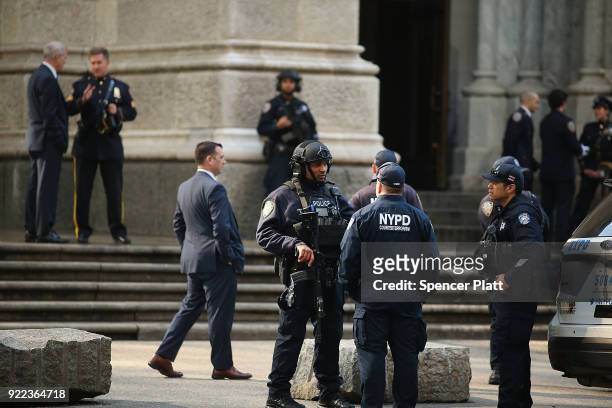 Counter terrorism police stand guard outside of St. Patrick's Cathedral as a memorial Mass is held for NYPD Officer Edward Byrne almost 30 years...