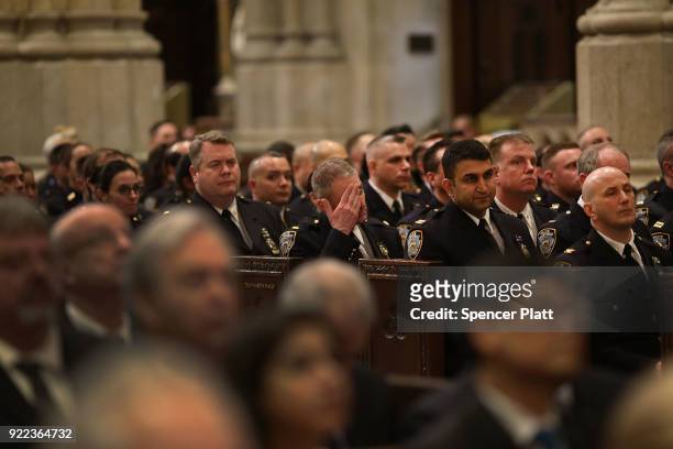 Police attend a service at St. Patrick's Cathedral as a memorial Mass is held for NYPD Officer Edward Byrne almost 30 years after he was executed by...