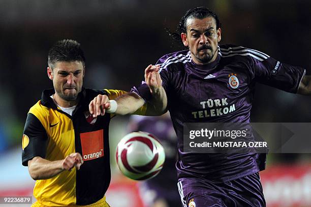 Servet Cetin of Galatasaray vies with Andrei Cristea of Dinamo Bucuresti during the Europa League football match at Ali Sami Yen Stadium in Istanbul...