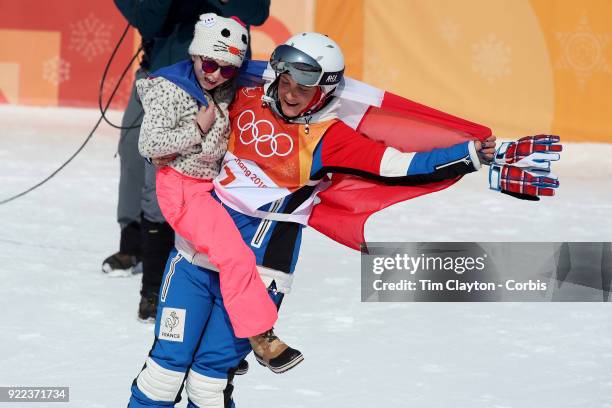 Marie Martinod of France after winning the silver medal celebrates with daughter Melirose during the Freestyle Skiing - Ladies' Ski Halfpipe Final at...