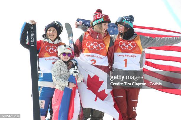 Marie Martinod of France after winning the silver medal celebrates with daughter Melirose along with gold medalist Cassie Sharpe of Canada and bronze...