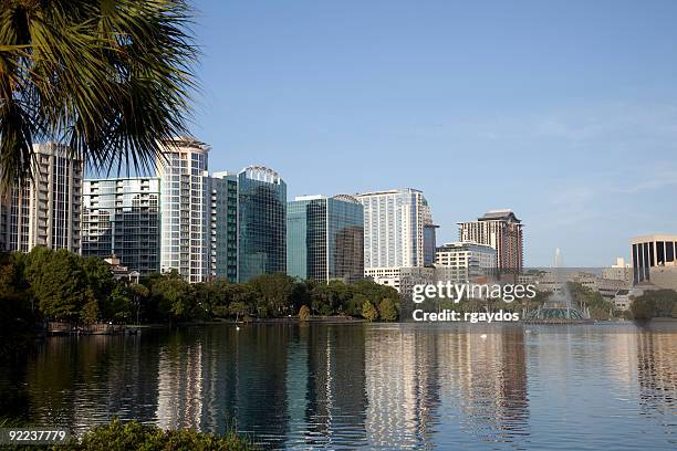 orlando skyline from lake eola - orlando florida lake eola stock pictures, royalty-free photos & images