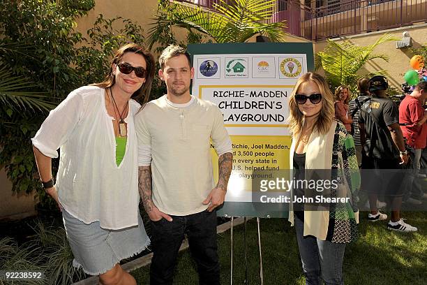 Caire Stansfield, Founder and Creative Director of C&C California, musician Joel Madden, and television personality Nicole Richie attend the ribbon...