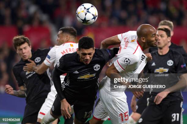 Manchester United's English defender Chris Smalling vies with Sevilla's French midfielder Steven N'Zonzi during the UEFA Champions League round of 16...