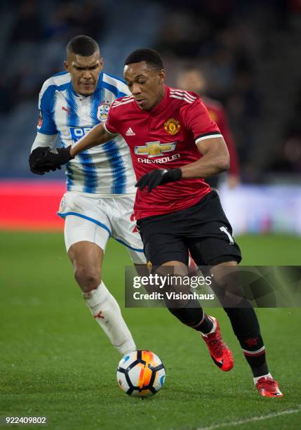 Anthony Martial of Manchester United and Collin Quaner of Huddersfield Town in action during the FA Cup Fifth Round match between Huddersfield Town...