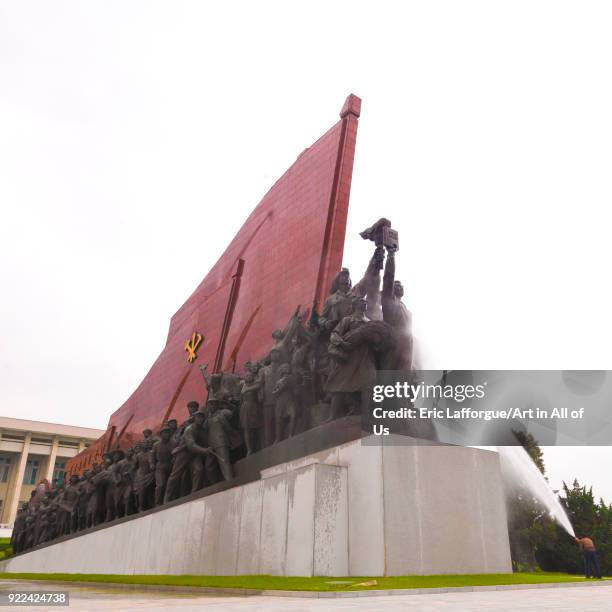 North Korean man cleaning the statues of North koreans in their anti-japanese revolutionary struggle in Mansudae Grand monument, Pyongan Province,...