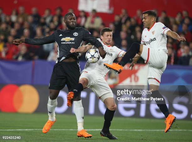 Romelu Lukaku of Manchester United in action with Clement Lenglet and Gabriel Mercado of Sevilla FC during the UEFA Champions League Round of 16...