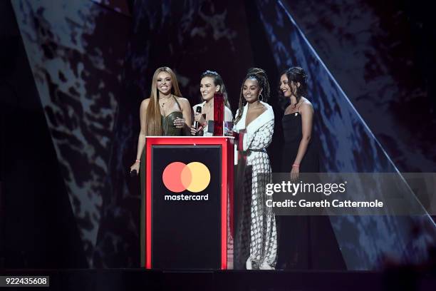 Jesy Nelson, Perrie Edwards, Leigh-Anne Pinnock and Jade Thirlwall of Little Mix speak on stage at The BRIT Awards 2018 held at The O2 Arena on...