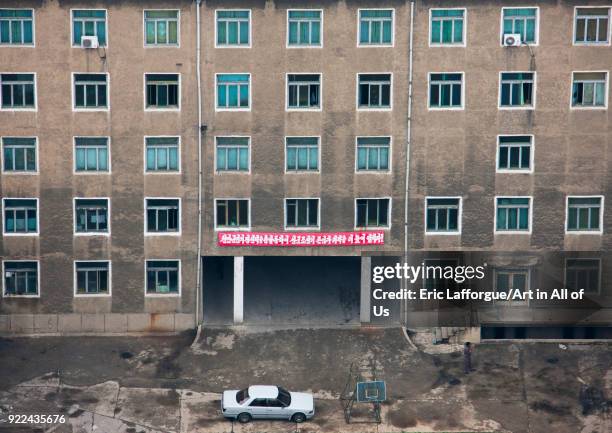 High angle view of buildings in the city center with a car parket at the entrnace, Pyongan Province, Pyongyang, North Korea on May 16, 2009 in...