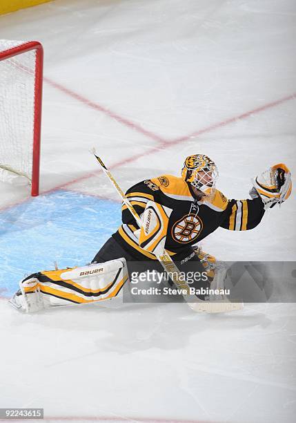 Tim Thomas of the Boston Bruins catches the puck against the Nashville Predators at the TD Garden on October 21, 2009 in Boston, Massachusetts.