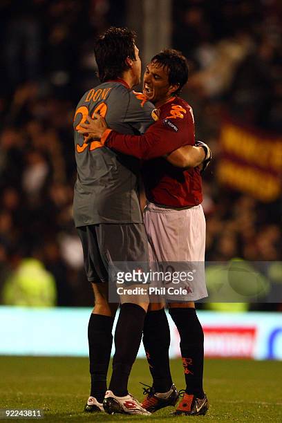 Nicolas Burdisso of AS Roma and AS Roma goalkeeper Doni celebrate after their team mate Marco Andreolli of AS Roma equalized during the Group E...