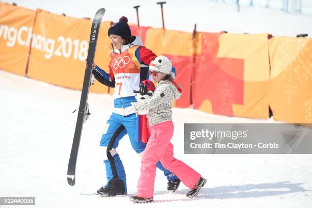 Marie Martinod of France after winning the silver medal heads to the podium with her daughter Melirose during the Freestyle Skiing - Ladies' Ski...