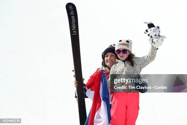 Marie Martinod of France after winning the silver medal celebrates with daughter Melirose during the Freestyle Skiing - Ladies' Ski Halfpipe Final at...